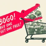 An editorial illustration of a red BOGO price tag shaped like an alligator snapping its jaws shut around a shopping cart full of cash.